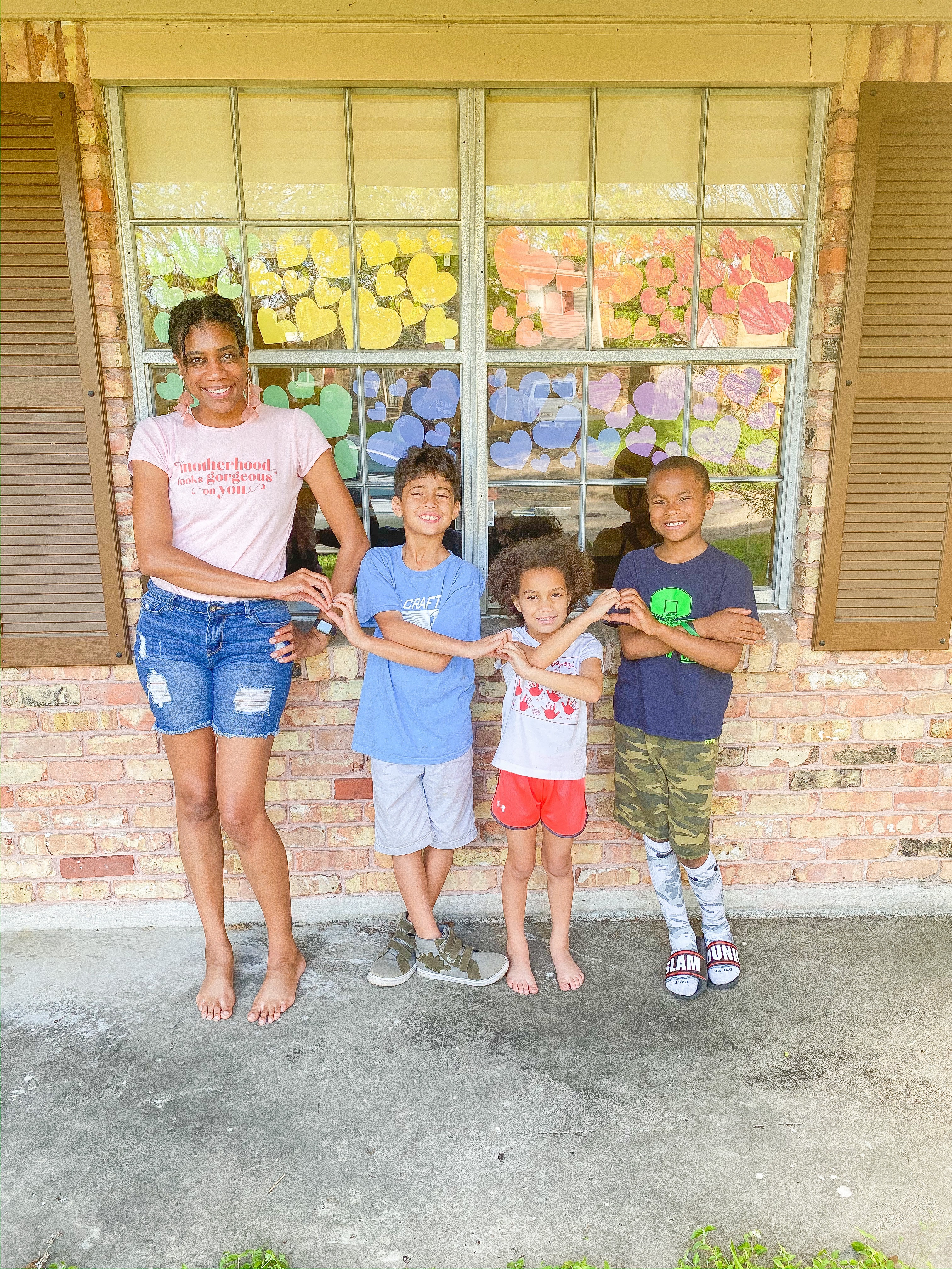 Hearts show love within family photo. #familyphotoideas #familyphotos #porchphotoideas #heartsphoto #photosathome #kidsphotos