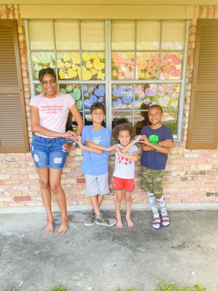 Hearts show love within family photo. #familyphotoideas #familyphotos #porchphotoideas #heartsphoto #photosathome #kidsphotos